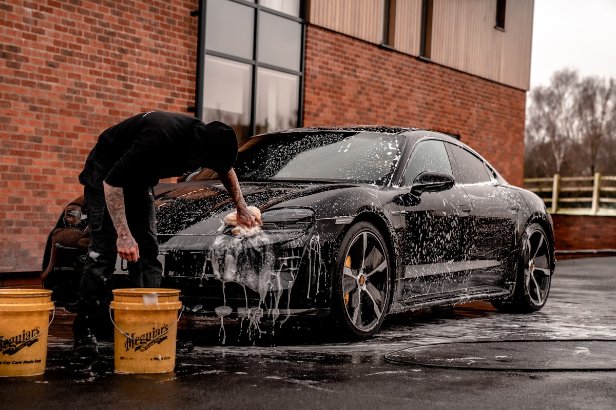 Hands-on foam wash during a professional detail