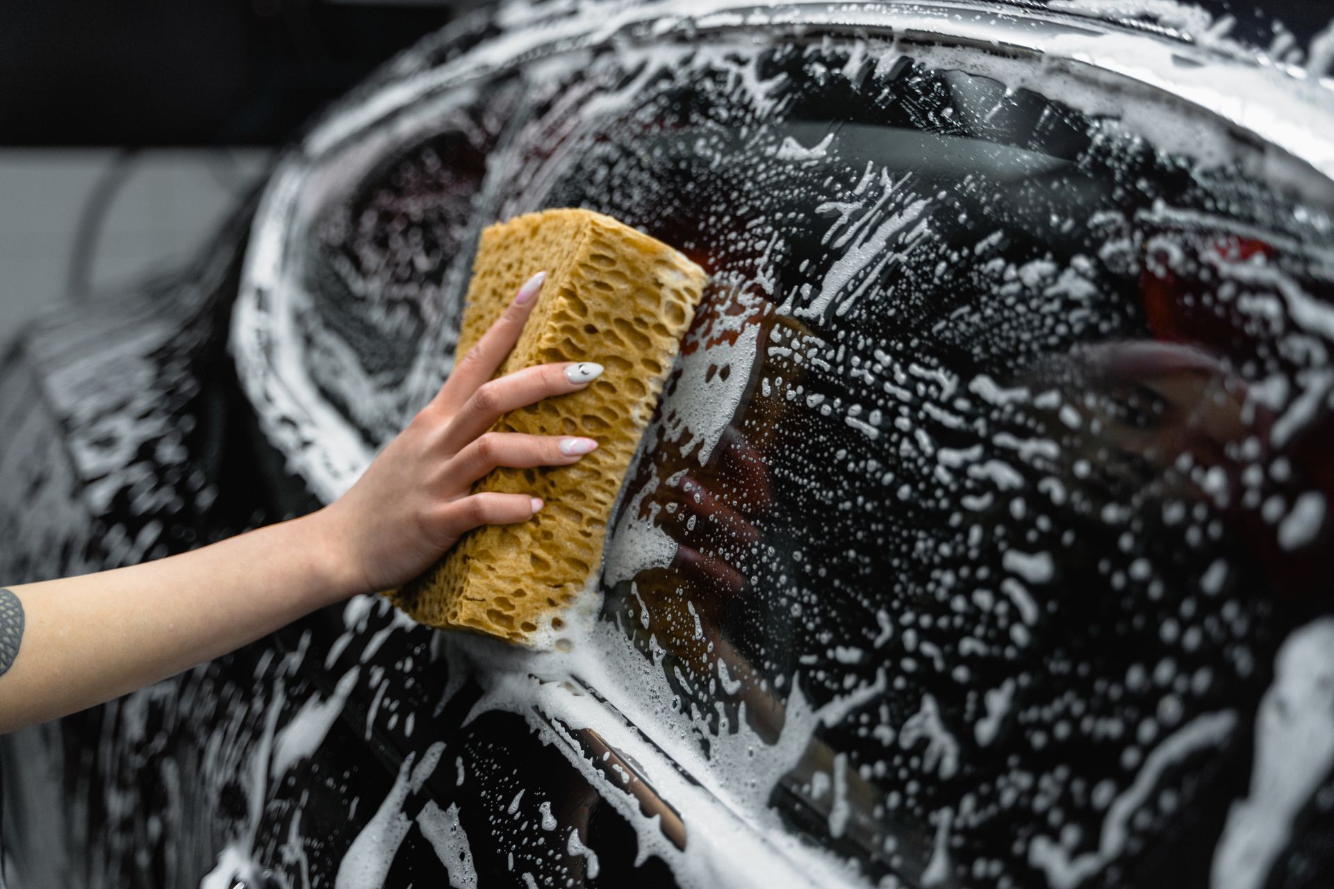Wash mitt and soap suds during exterior detail